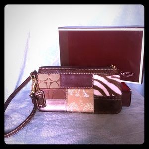 Coach mixed material wristlet.